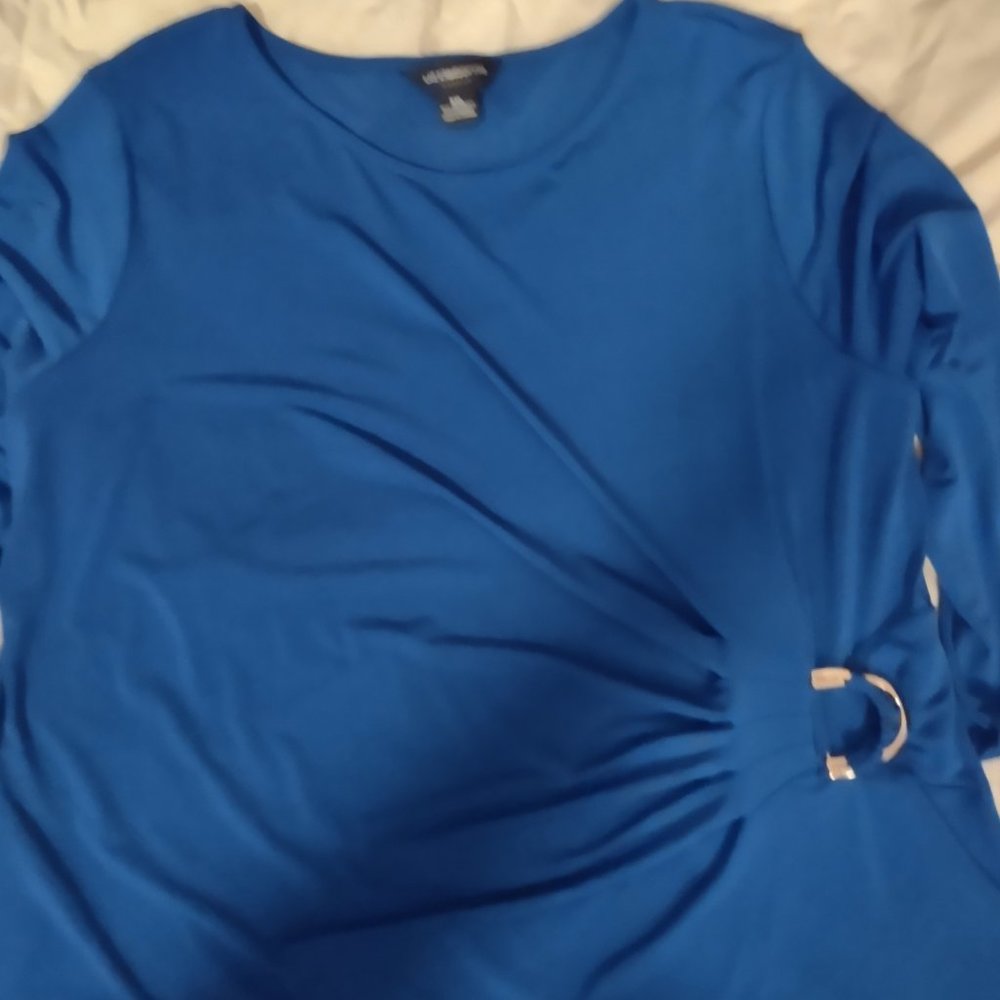 Blue blouse with gold ring